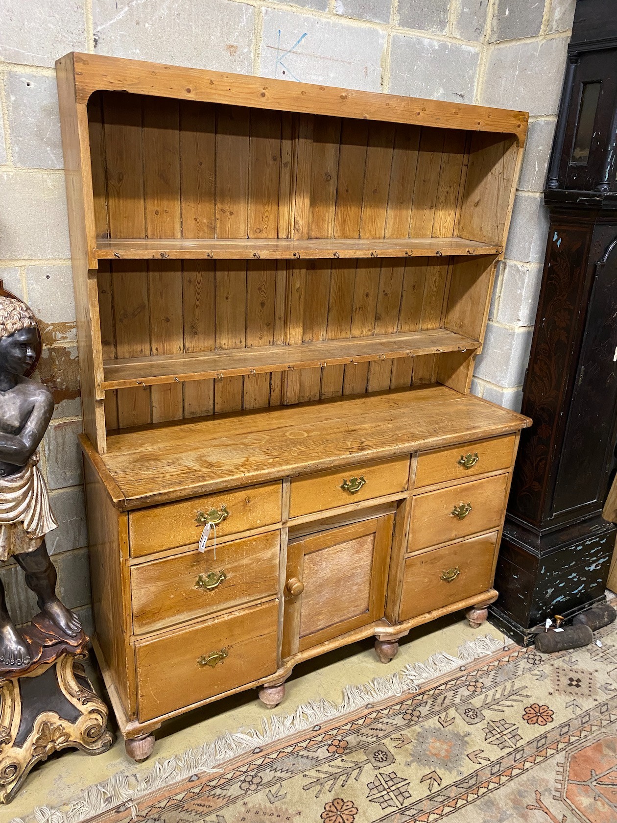 A Victorian pine kitchen dresser, enclosed rack, length 140cm, depth 46cm, height 184cm